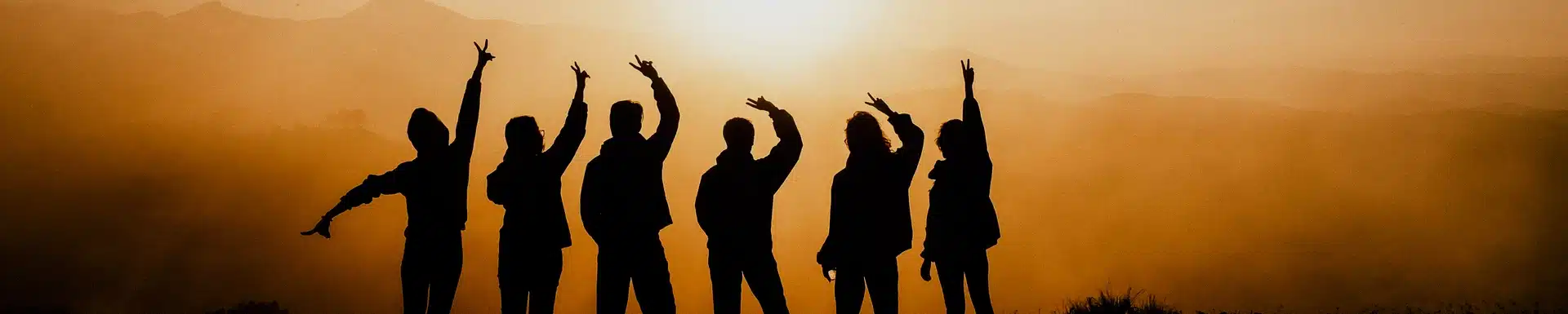 image of six humans in the mountains